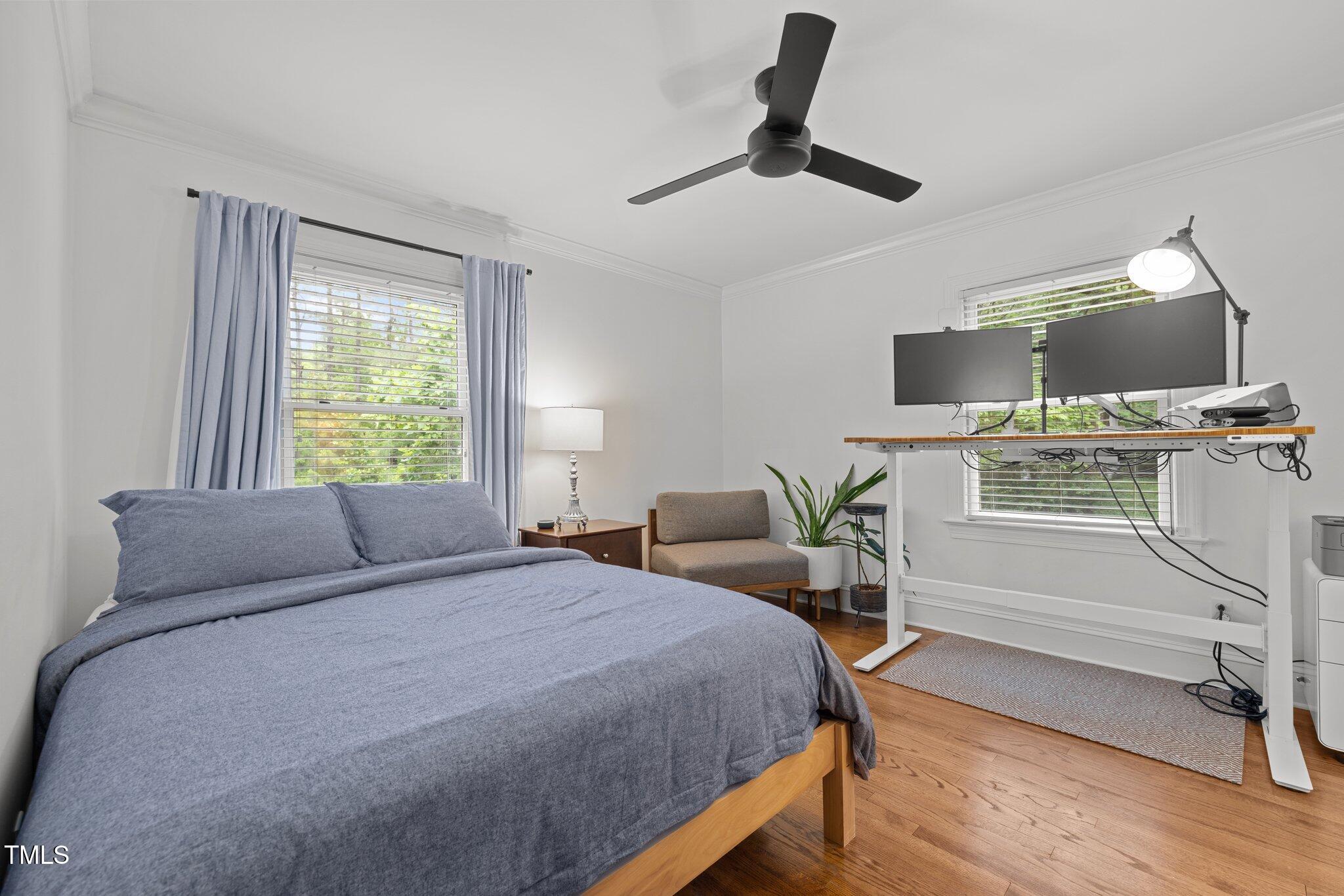 1706 Rangecrest Road Raleigh, NC 27612 - Photo 21 of 43 a bedroom with a bed and a desk
