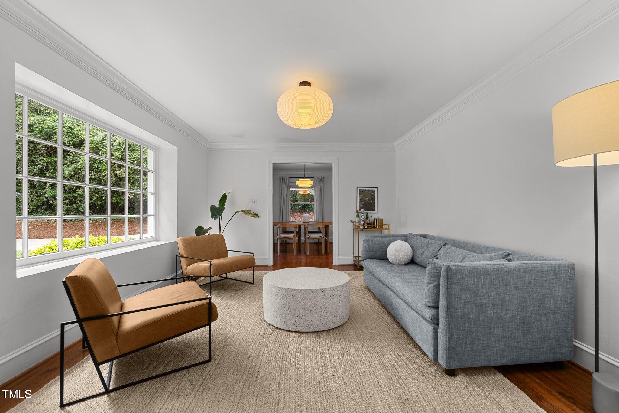 1706 Rangecrest Road Raleigh, NC 27612 - Photo 3 of 43 a living room with furniture and a window