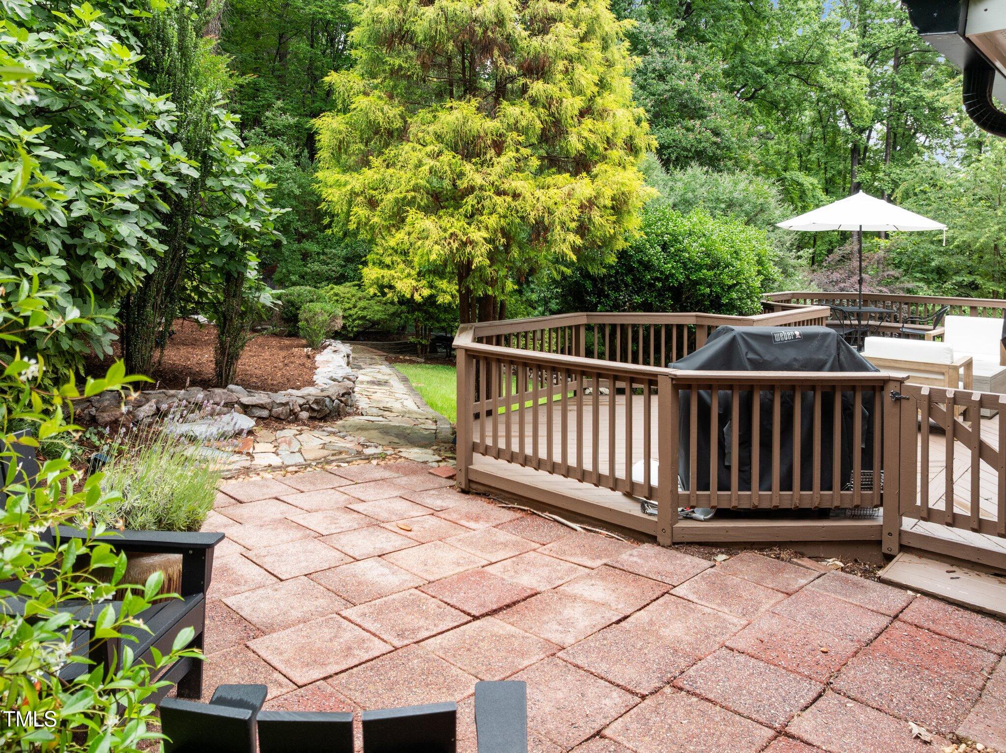 1706 Rangecrest Road Raleigh, NC 27612 - Photo 31 of 43 a view of a roof deck with wooden floor and fence