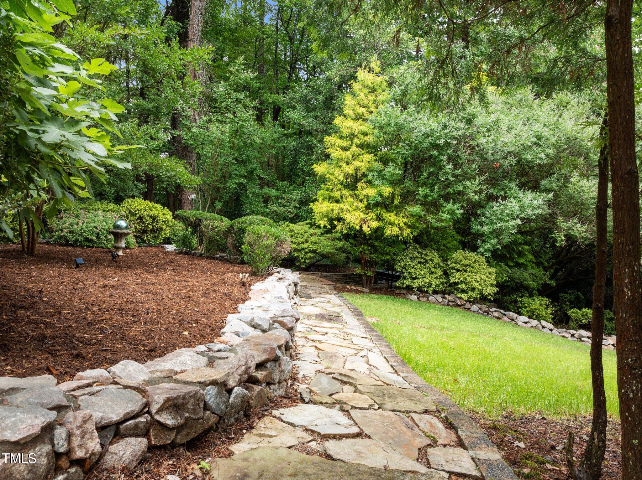 1706 Rangecrest Road Raleigh, NC 27612 - Photo 32 of 43 a view of a pathway both side of yard