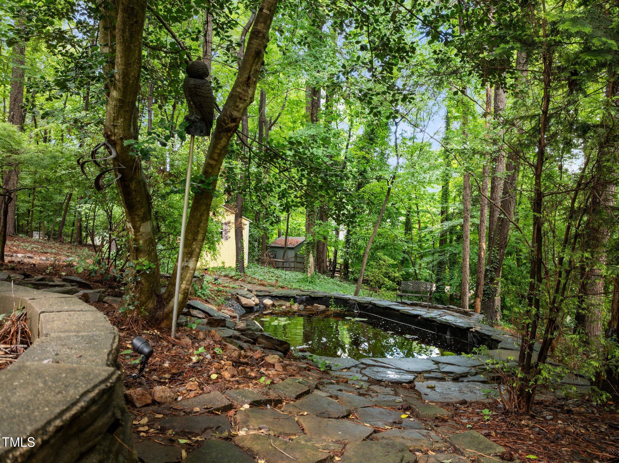 1706 Rangecrest Road Raleigh, NC 27612 - Photo 35 of 43 a view of a backyard with trees