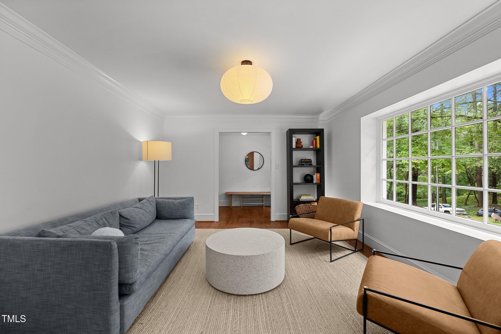 1706 Rangecrest Road Raleigh, NC 27612 - Photo 4 of 43 a living room with furniture and a window
