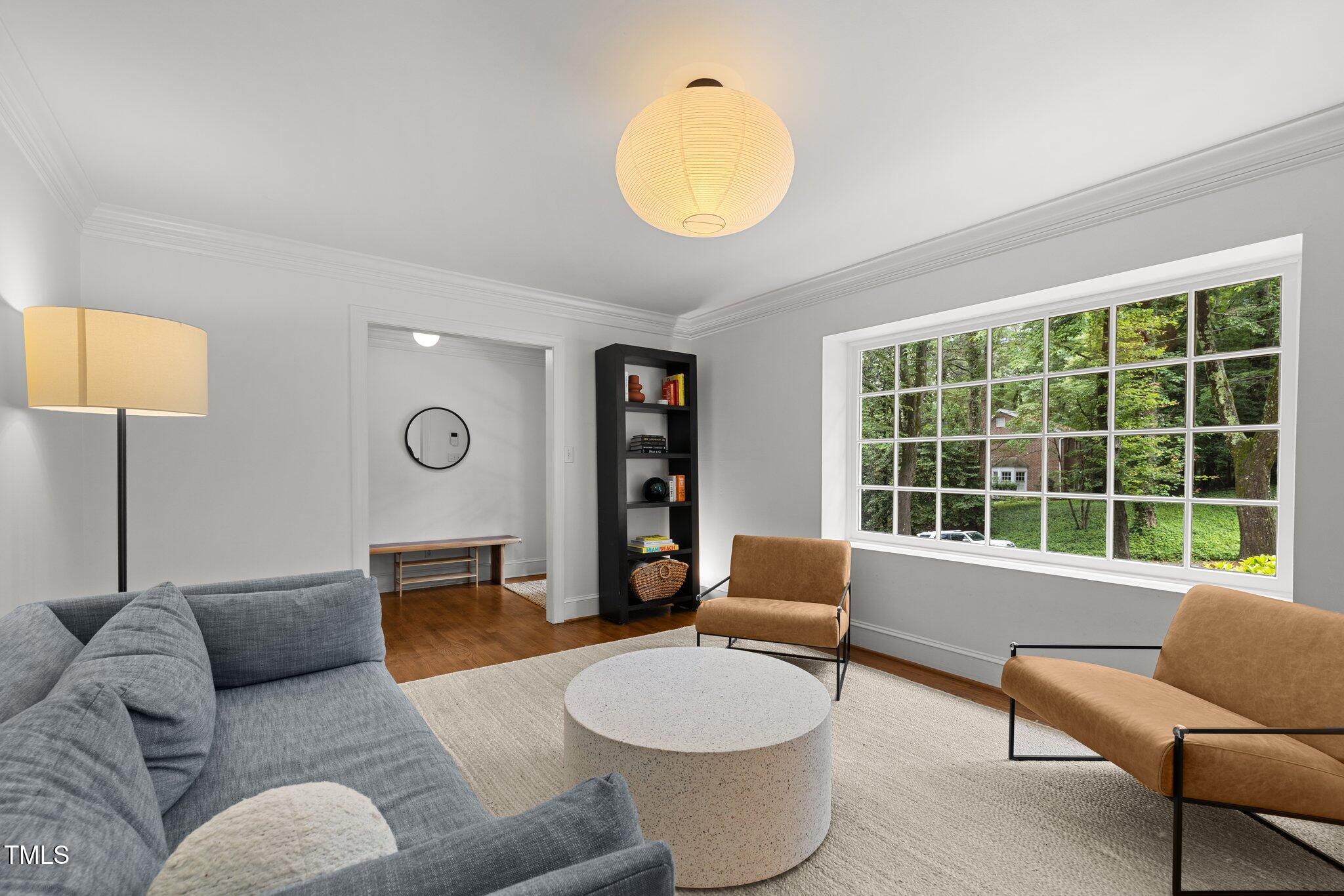 1706 Rangecrest Road Raleigh, NC 27612 - Photo 5 of 43 a living room with furniture and a large window