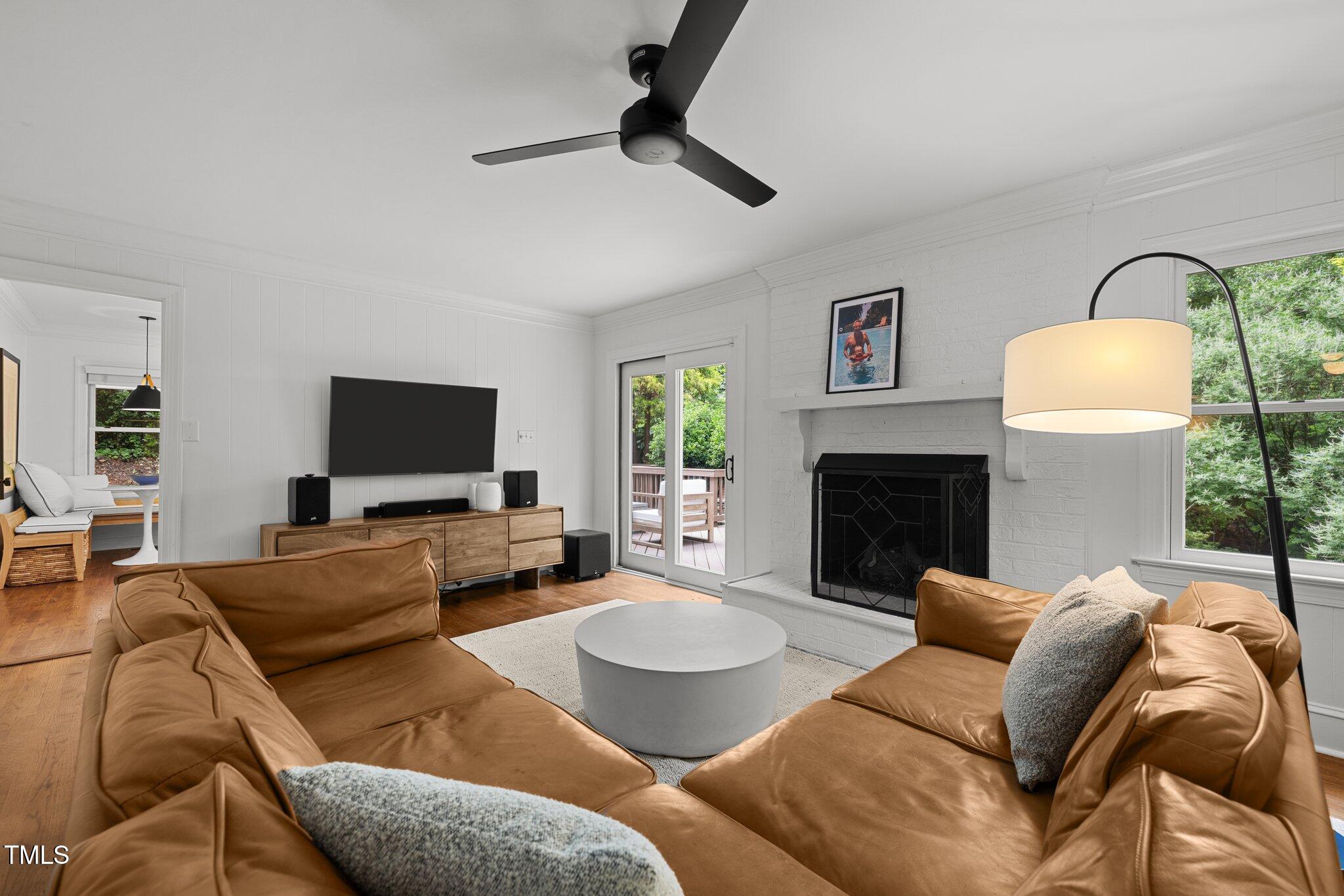 1706 Rangecrest Road Raleigh, NC 27612 - Photo 6 of 43 a living room with furniture and a fireplace