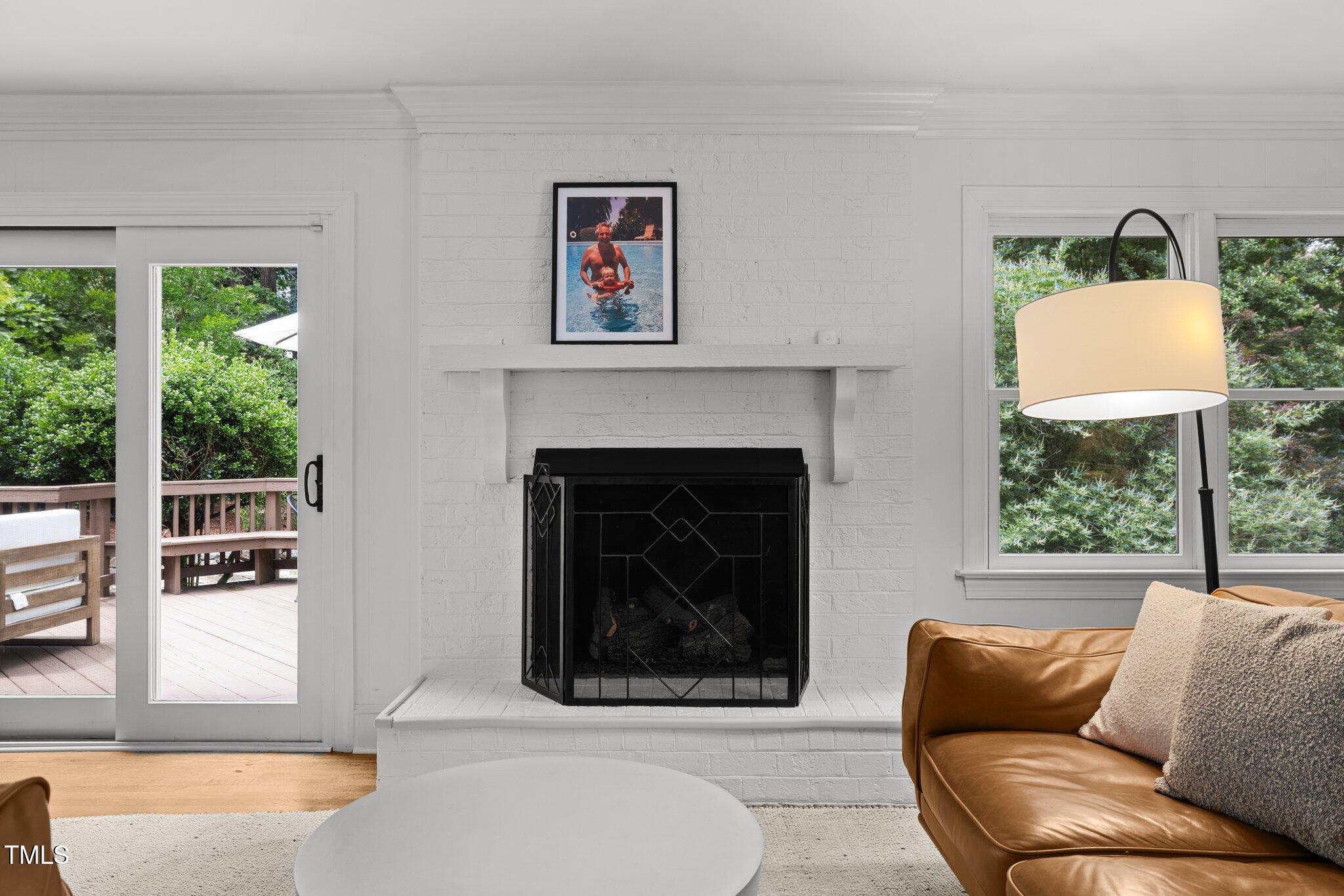 1706 Rangecrest Road Raleigh, NC 27612 - Photo 7 of 43 a living room with furniture and a fireplace