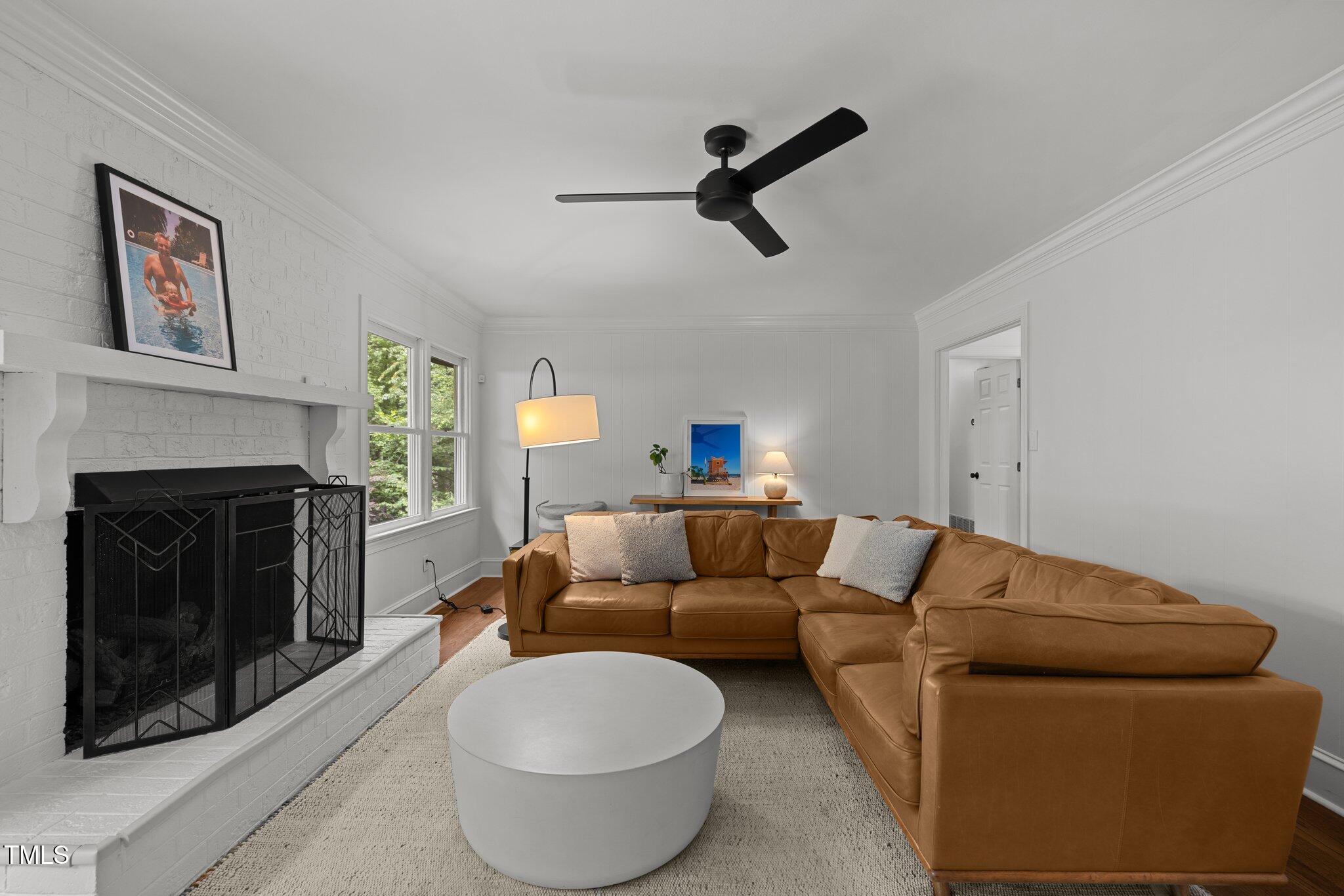 1706 Rangecrest Road Raleigh, NC 27612 - Photo 8 of 43 a living room with furniture and a fireplace