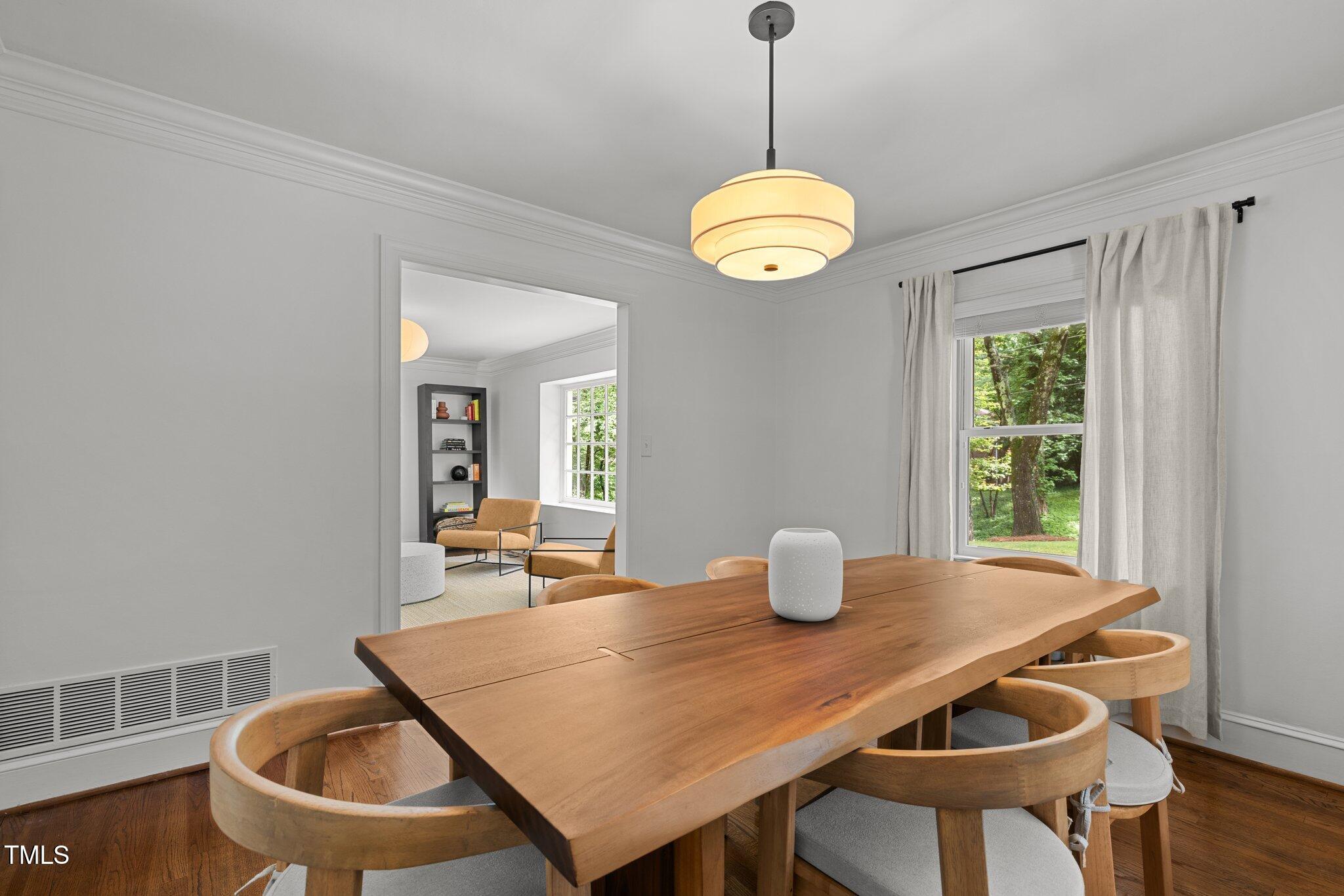 1706 Rangecrest Road Raleigh, NC 27612 - Photo 10 of 43 a view of a dining table and chairs in the room