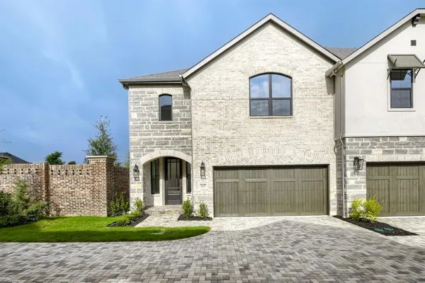 a front view of a house with yard