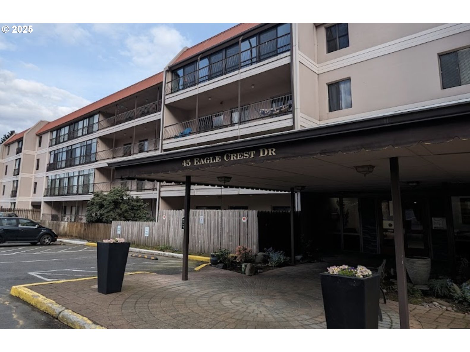 45 Eagle Crest Drive, Unit 407 Lake Oswego, OR 97035 - Photo 1 of 28 a backyard of a house with barbeque oven and outdoor seating