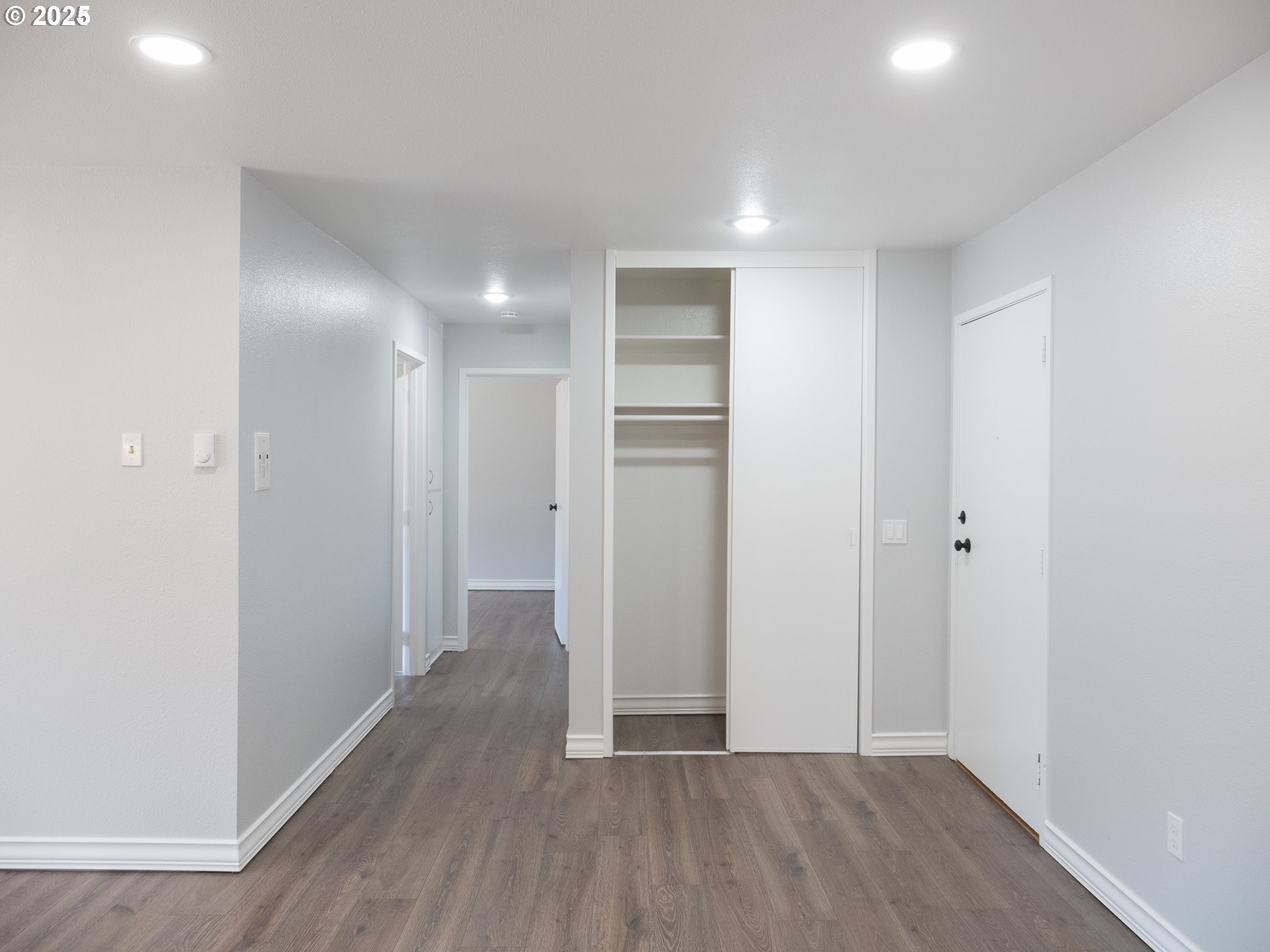 45 Eagle Crest Drive, Unit 407 Lake Oswego, OR 97035 - Photo 12 of 28 a view of a hallway with wooden floor