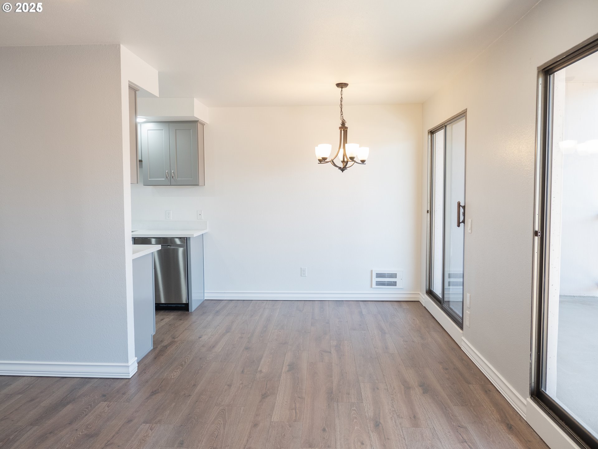 45 Eagle Crest Drive, Unit 407 Lake Oswego, OR 97035 - Photo 13 of 28 a view of empty room with wooden floor and window