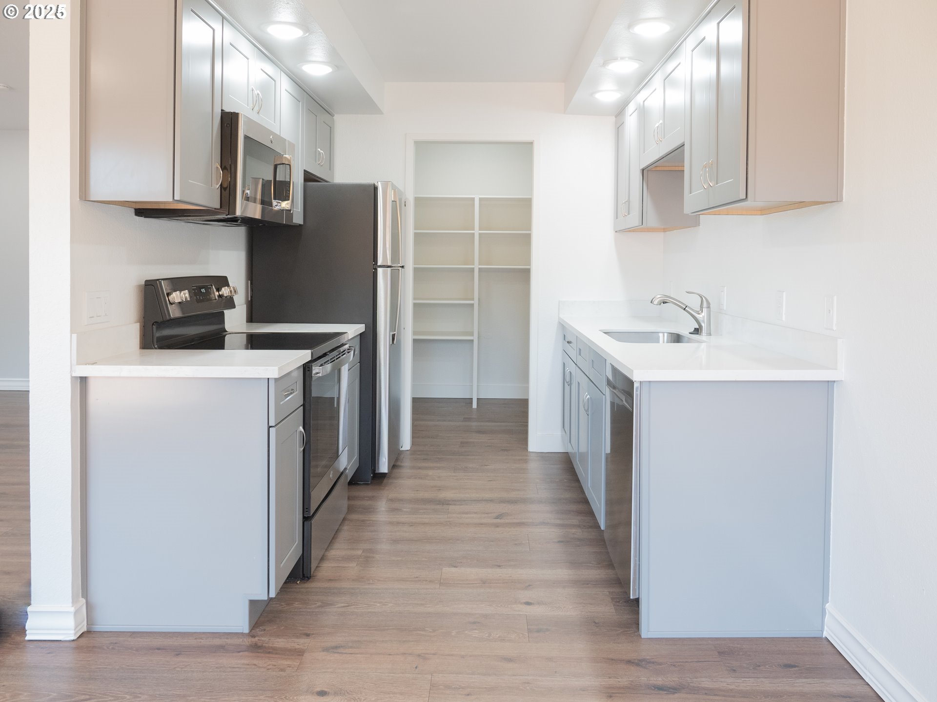 45 Eagle Crest Drive, Unit 407 Lake Oswego, OR 97035 - Photo 14 of 28 a kitchen with a sink a stove and refrigerator