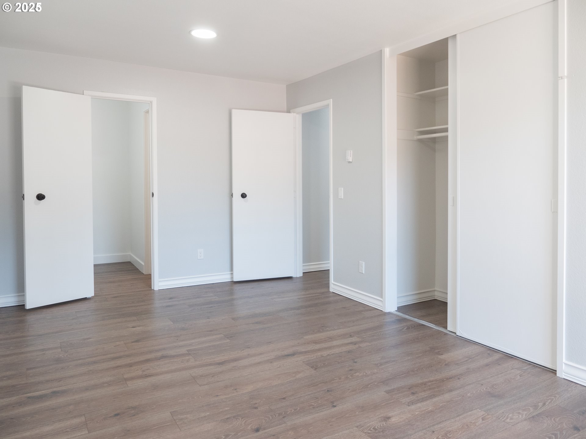 45 Eagle Crest Drive, Unit 407 Lake Oswego, OR 97035 - Photo 23 of 28 a view of an empty room with wooden floor