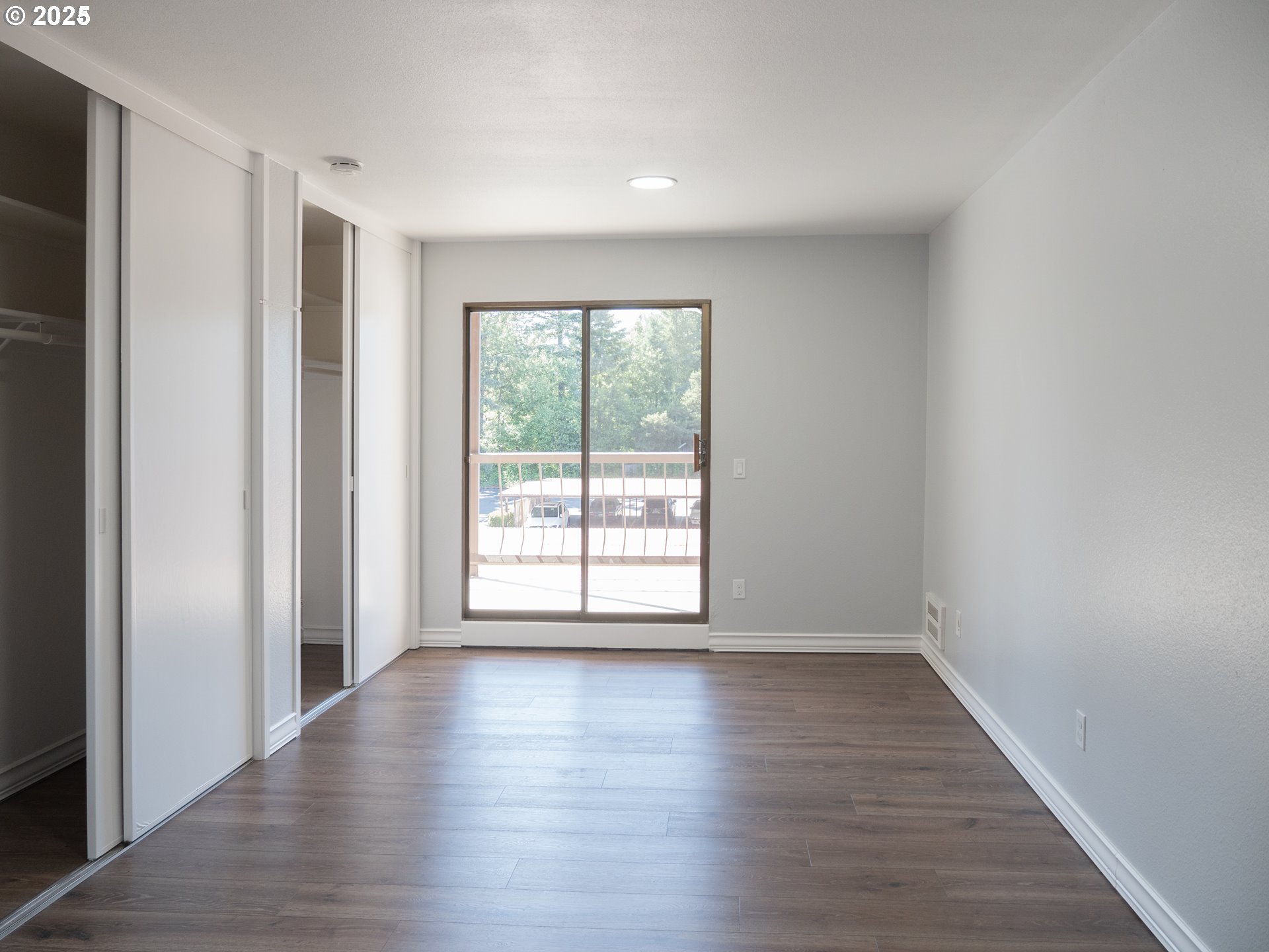 45 Eagle Crest Drive, Unit 407 Lake Oswego, OR 97035 - Photo 24 of 28 a view of an empty room with wooden floor and a window