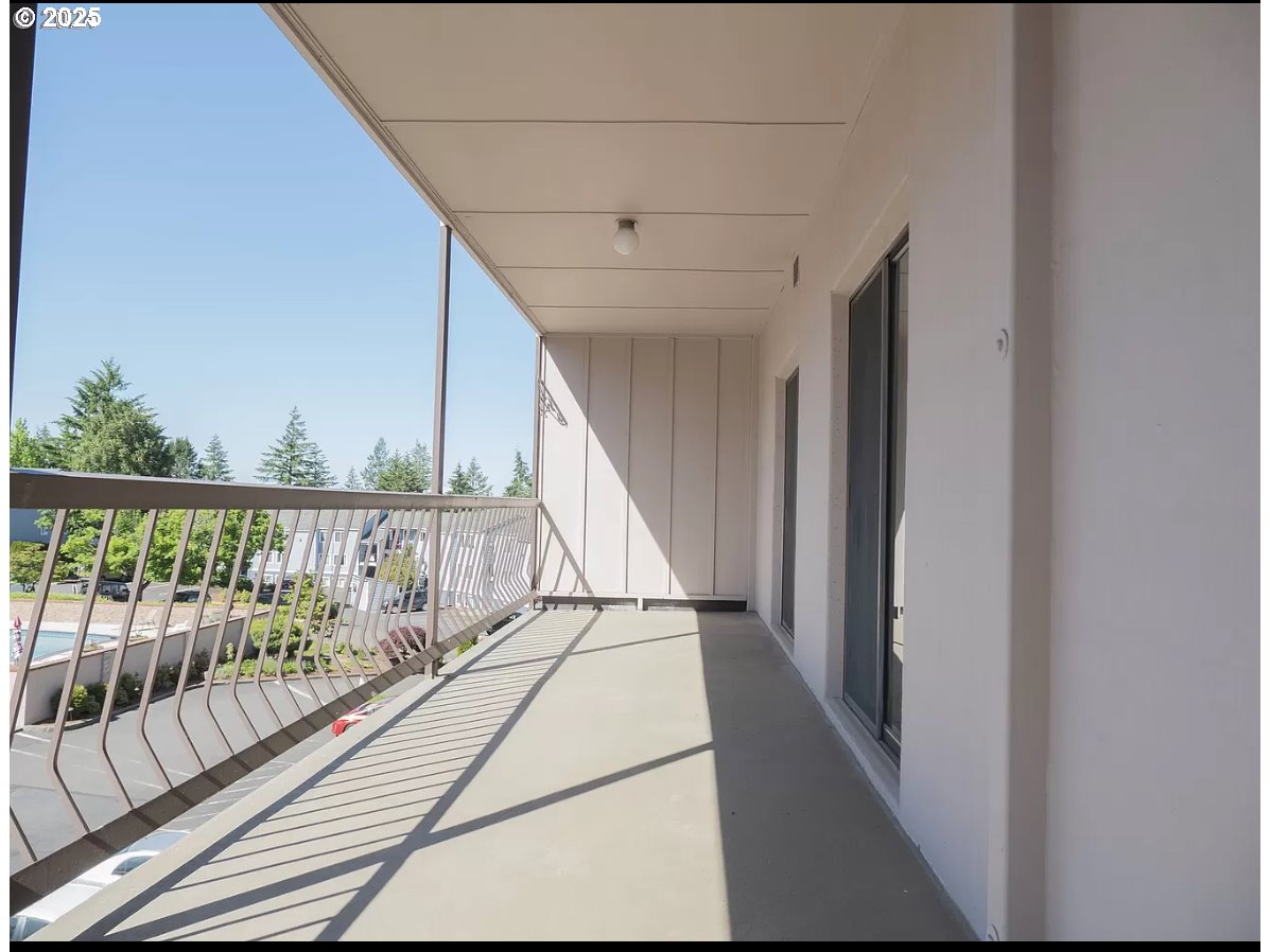 45 Eagle Crest Drive, Unit 407 Lake Oswego, OR 97035 - Photo 25 of 28 a view of balcony with wooden floor
