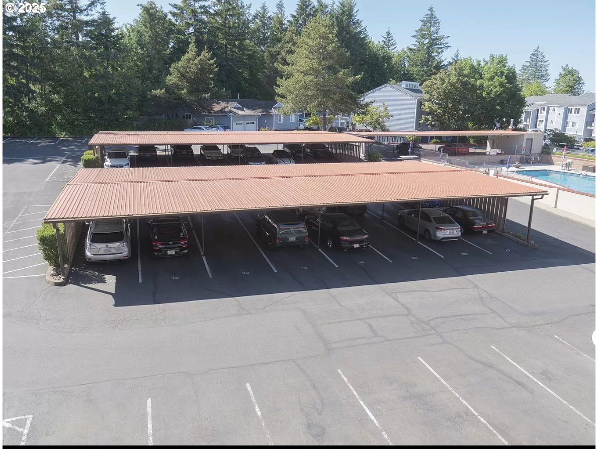 45 Eagle Crest Drive, Unit 407 Lake Oswego, OR 97035 - Photo 26 of 28 a view of a terrace with chairs