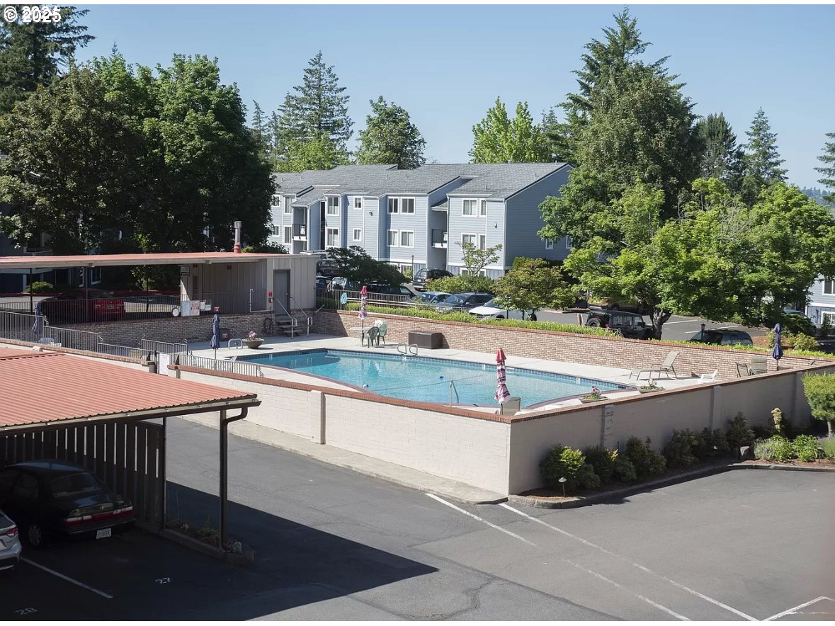 45 Eagle Crest Drive, Unit 407 Lake Oswego, OR 97035 - Photo 27 of 28 swimming pool view with a seating space and a garden