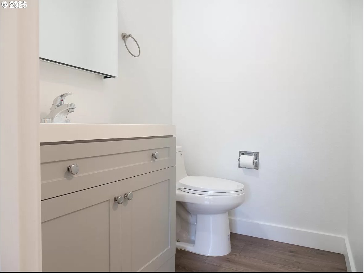 45 Eagle Crest Drive, Unit 407 Lake Oswego, OR 97035 - Photo 6 of 28 a bathroom with a toilet sink and mirror
