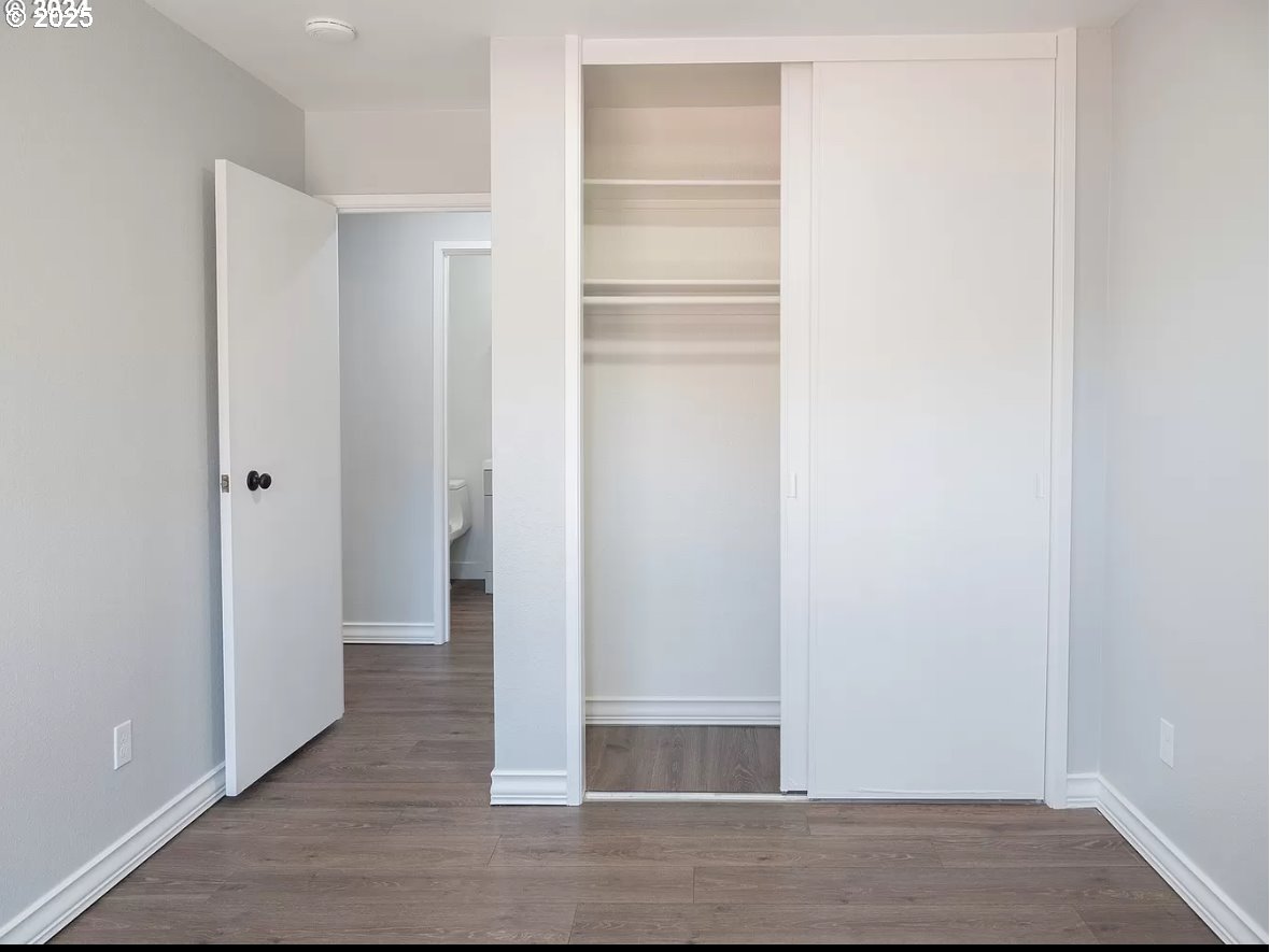 45 Eagle Crest Drive, Unit 407 Lake Oswego, OR 97035 - Photo 9 of 28 a view of walk in closet with wooden floor