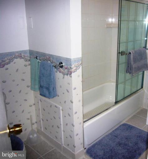 10160 High Ridge Road Laurel, MD 20723 - Photo 14 of 16 MASTER BATH WITH GLASS SLIDERS AND SHOWER UNIT