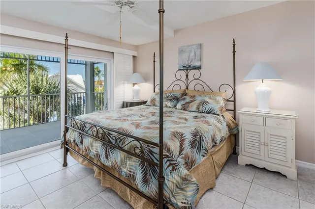 a bedroom with a bed and large mirror