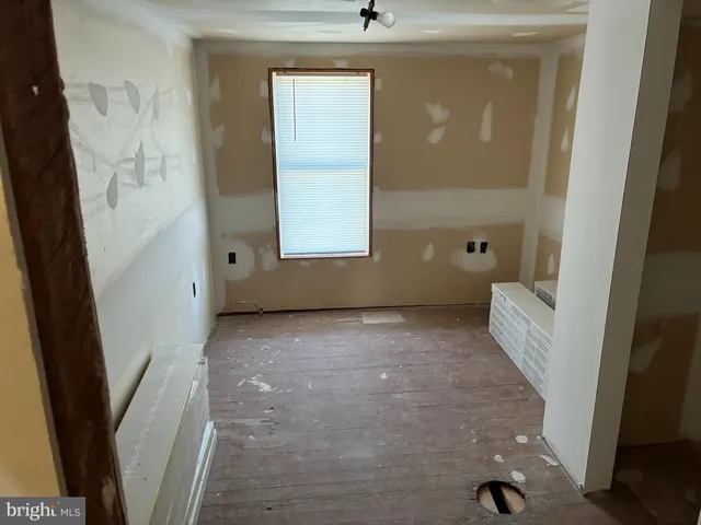 en empty room with windows