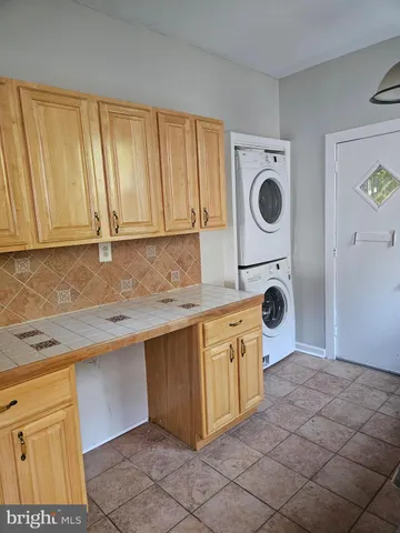 a kitchen with a stove a sink and a refrigerator