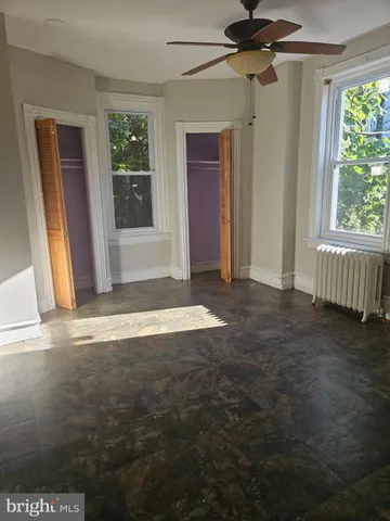 a view of empty room with floor to ceiling window