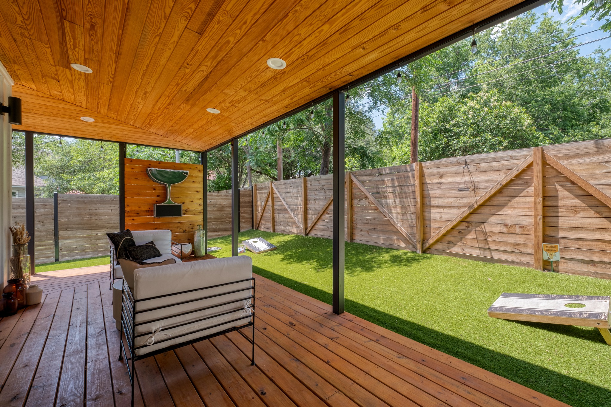 1904 East 16th Street, Unit 2 Austin, TX 78702 - Photo 3 of 20 Covered outdoor patio with a plank wood ceiling featuring recessed lighting