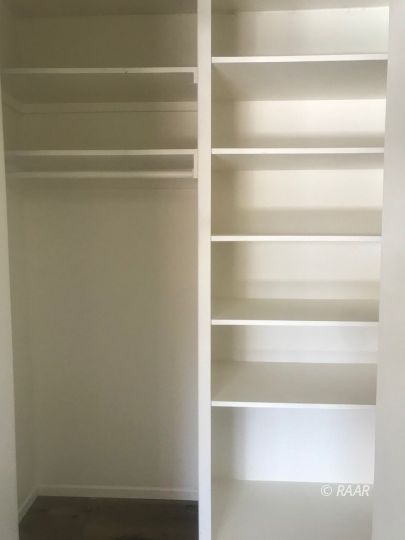 303 West Howell Avenue Ridgecrest, CA 93555 - Photo 14 of 22 a view of walk in closet with empty racks