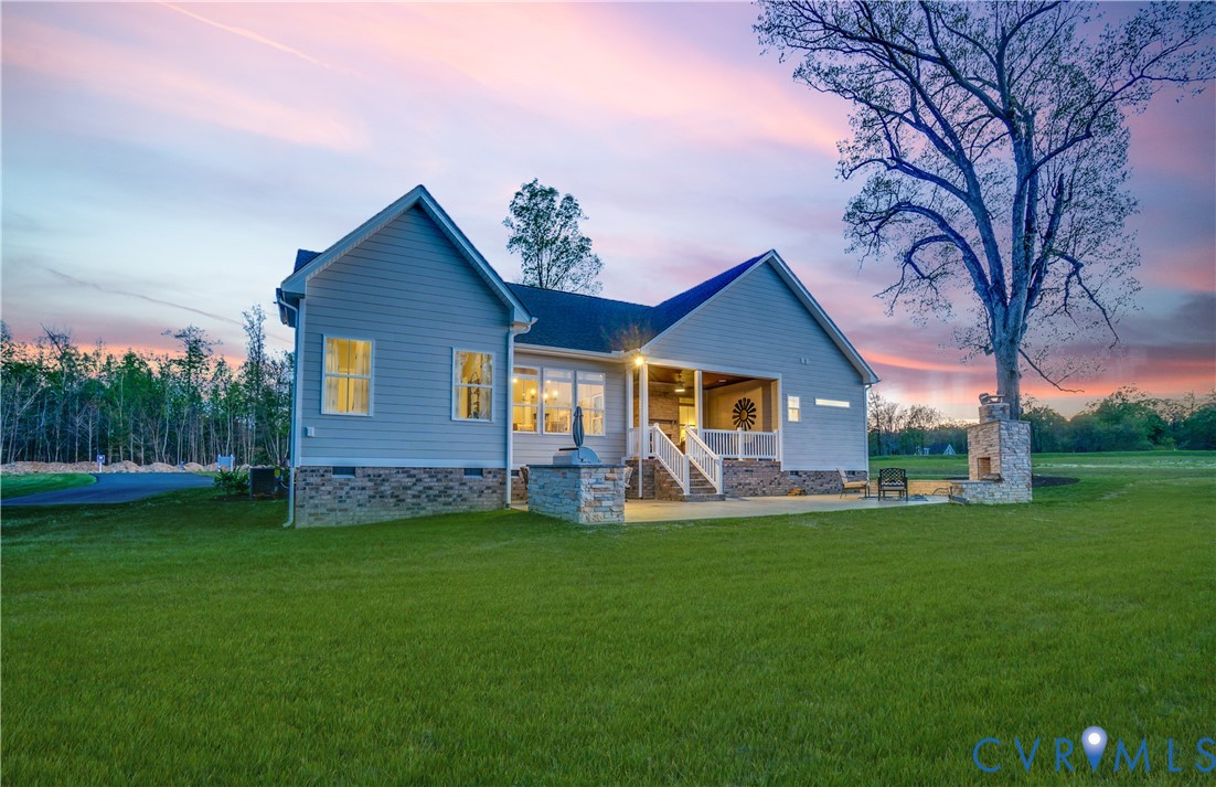 Lot 23 North Shore Road Locust Hill, VA 23092 - Photo 4 of 30 a front view of house with yard and green space