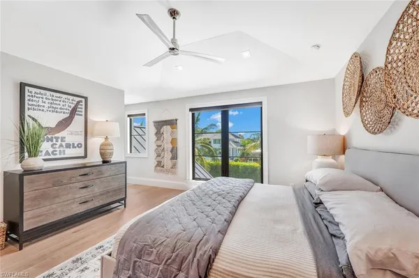 a spacious bedroom with a large bed and a window