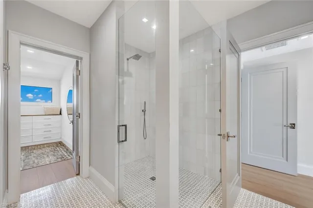 a bathroom with a shower and a sink