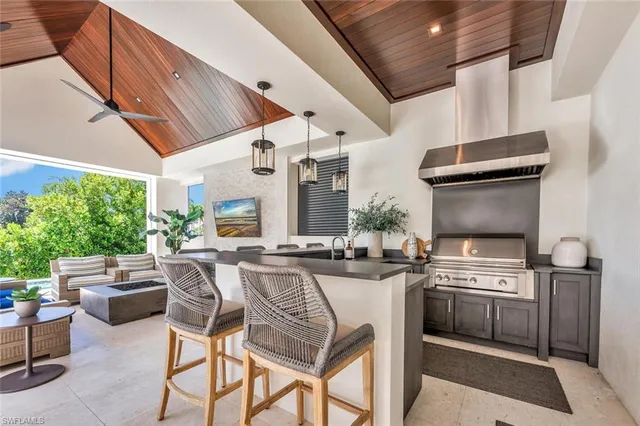 a kitchen with a stove a sink and a refrigerator