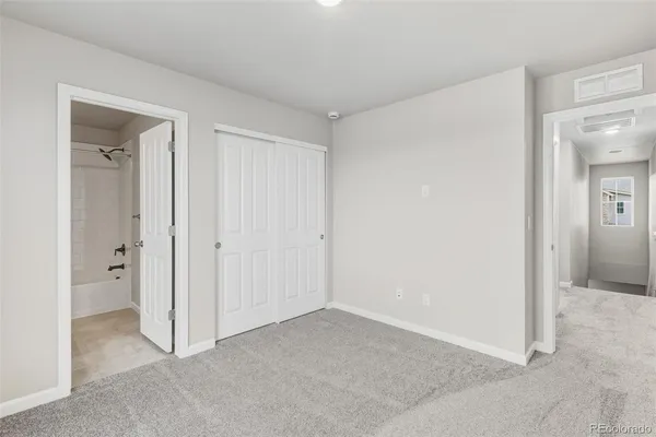 wooden floor and closet in a room