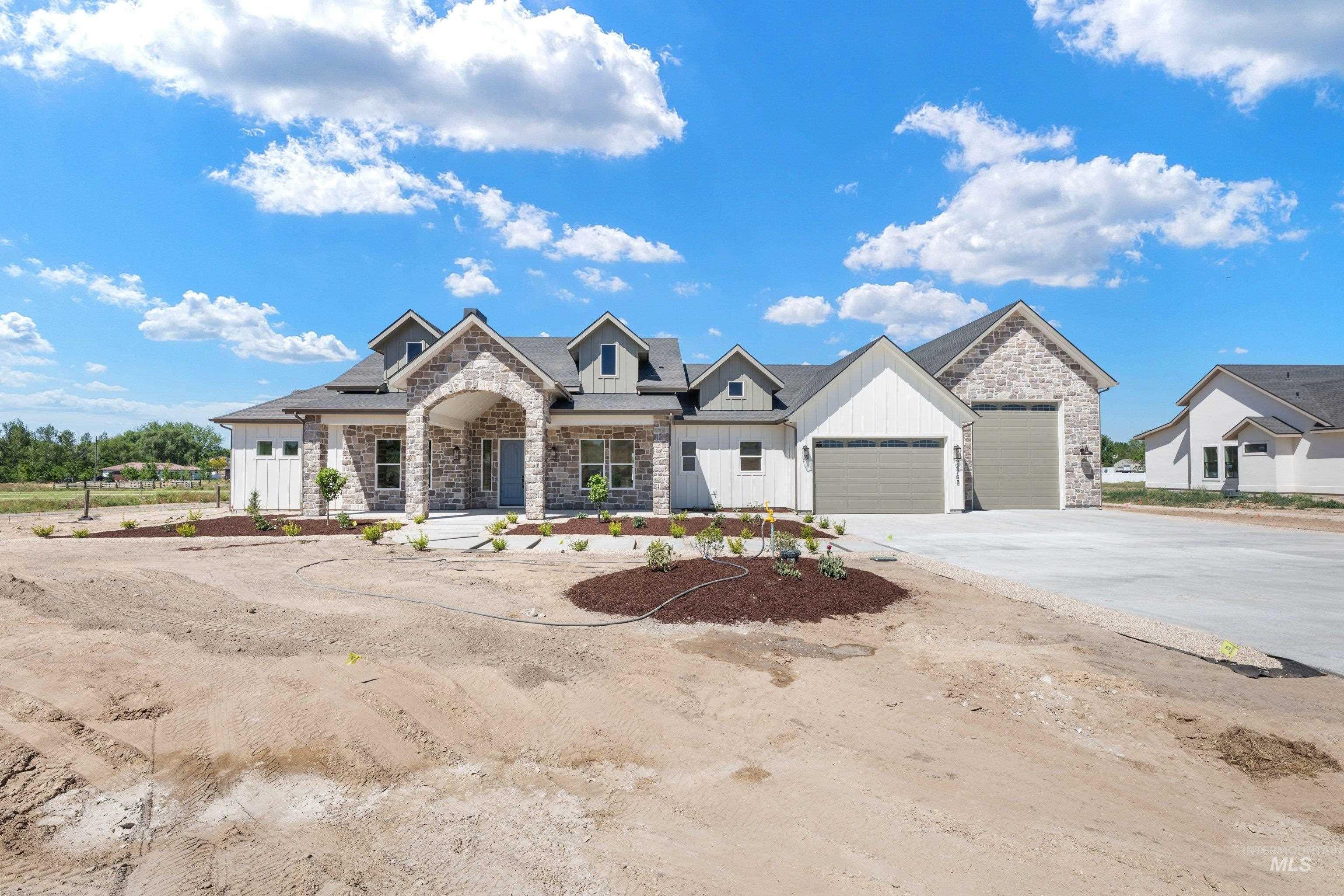 24821 Ardmore Court Caldwell, ID 83607 - Photo 41 of 43 Modern farmhouse-style residence featuring a prominent stone and white siding exterior