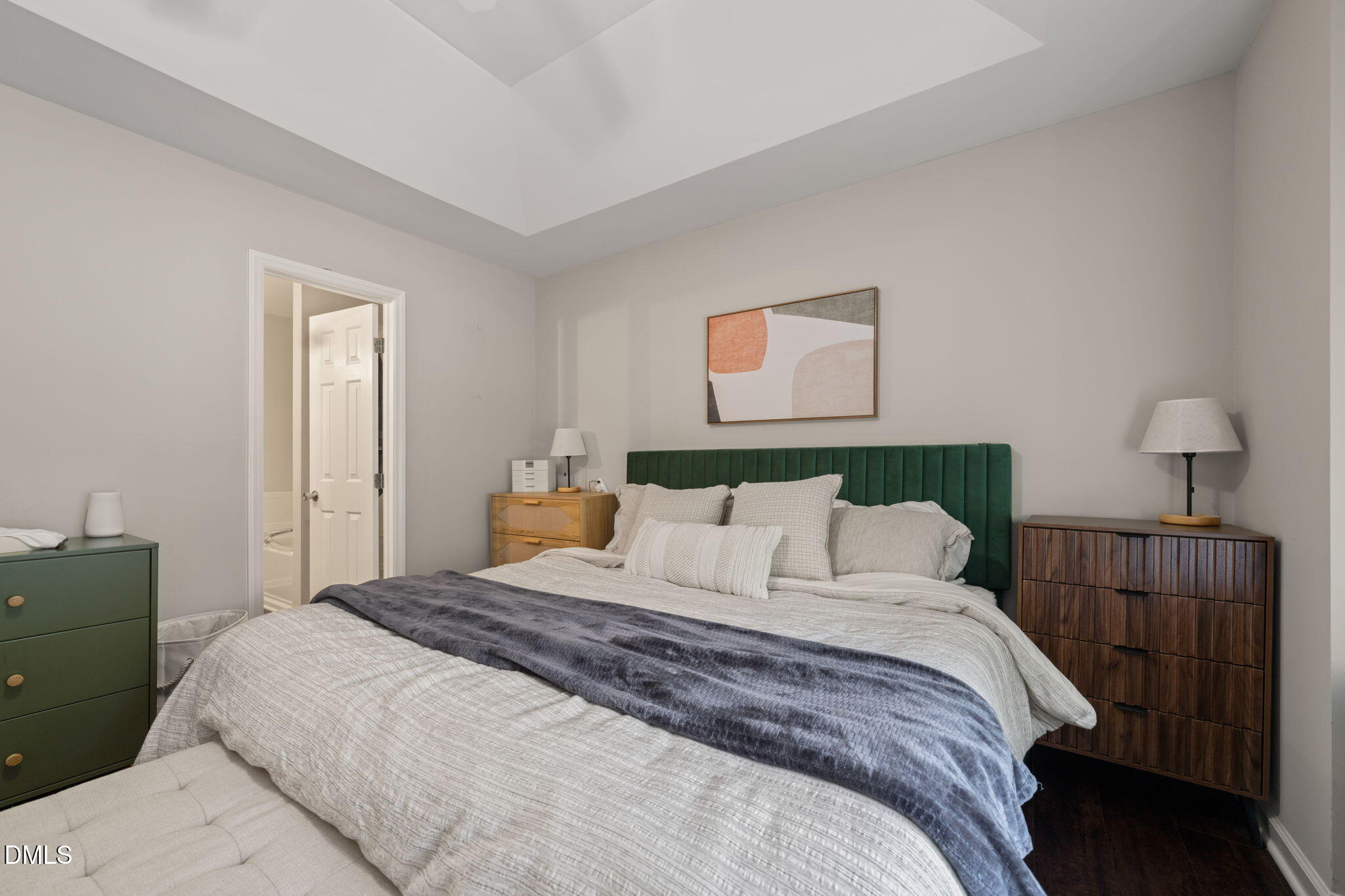 4323 Pine Springs Court Raleigh, NC 27613 - Photo 27 of 38 a bedroom with a bed and a night stand
