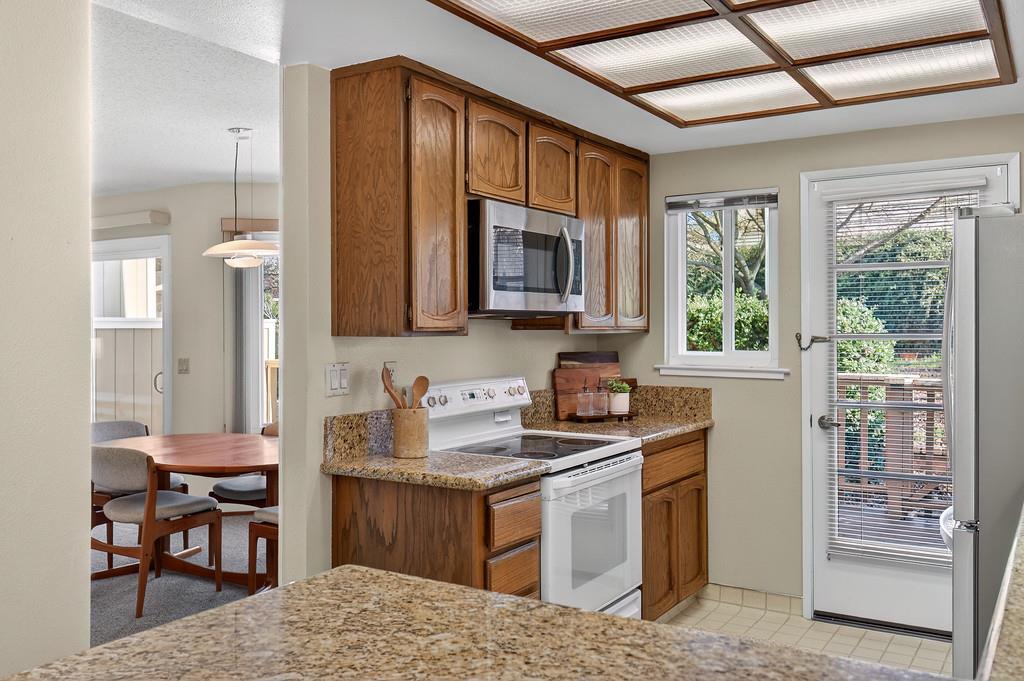 7059 Lompoc Court Citrus Heights, CA 95621 - Photo 16 of 53 a kitchen with a stove a sink and a microwave
