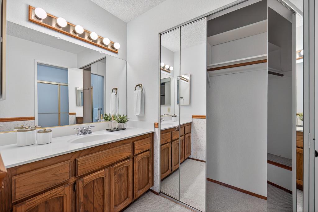 7059 Lompoc Court Citrus Heights, CA 95621 - Photo 40 of 53 a spacious bathroom with a double vanity sink and a mirror