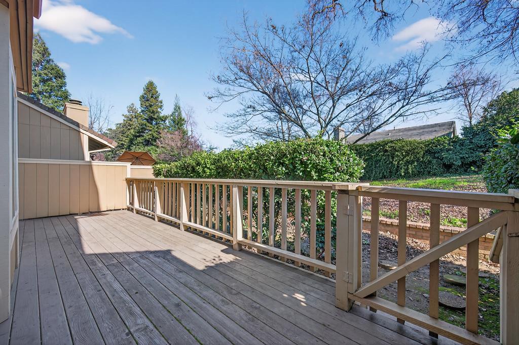 7059 Lompoc Court Citrus Heights, CA 95621 - Photo 43 of 53 a balcony with wooden floor and trees in the back