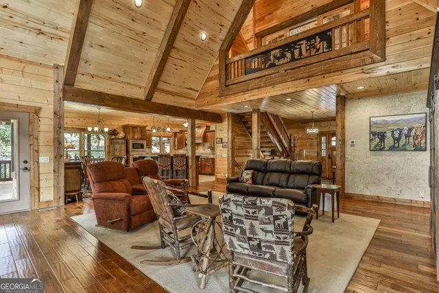 a bathroom with a granite countertop sink a mirror and shower