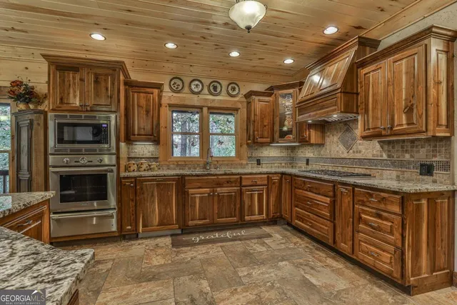 a kitchen with a stove and a refrigerator