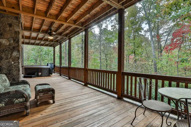 a view of a wooden chairs in balcony