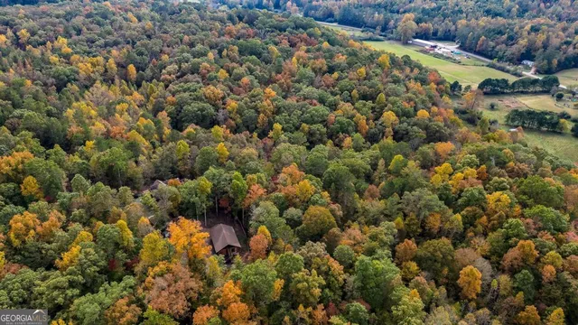 a living room with lots of furniture and chandelier