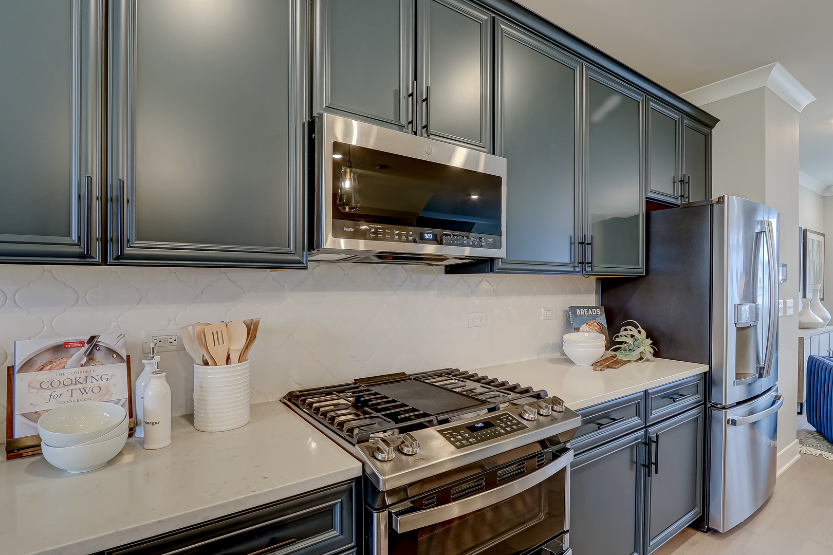 4465 Chelsea Mnr Circle Aurora, IL 60504 - Photo 12 of 30 a kitchen with stainless steel appliances granite countertop a stove and a microwave