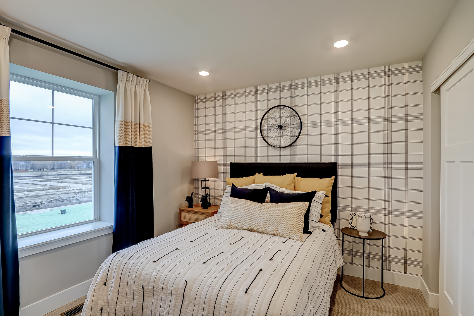 4465 Chelsea Mnr Circle Aurora, IL 60504 - Photo 27 of 30 a bedroom with a bed and a wall next to a window