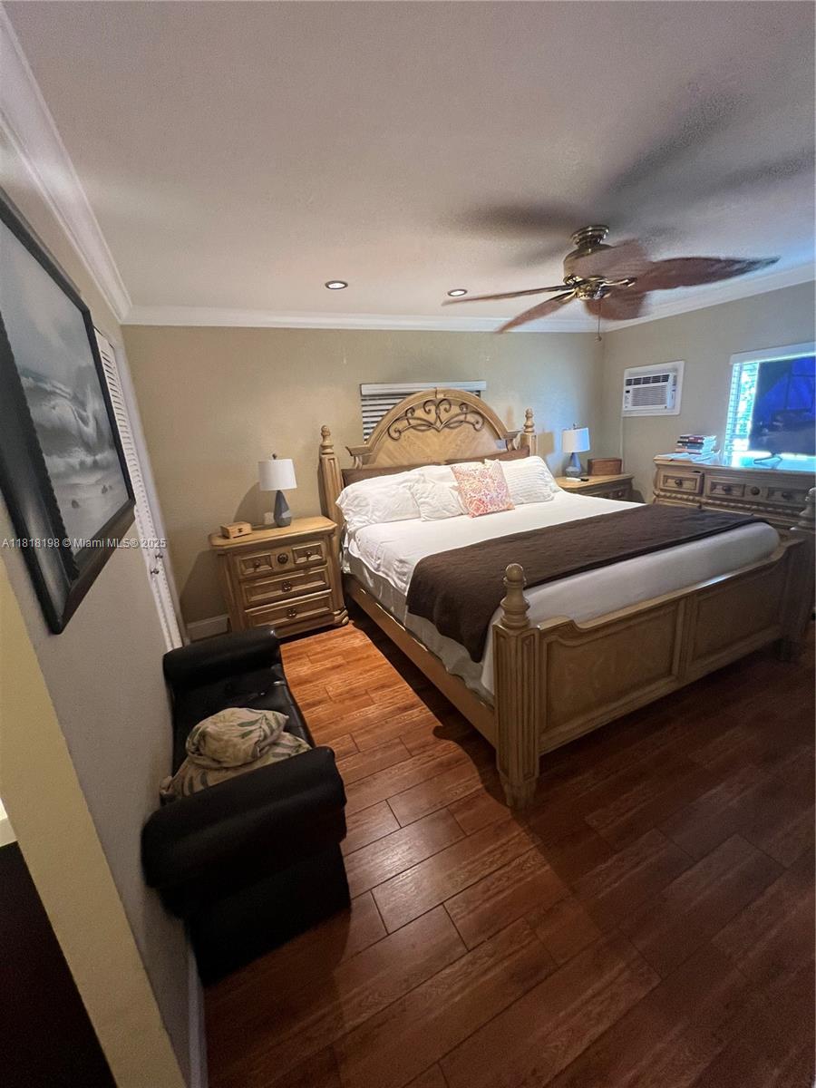 Davie Davie, FL 33324 - Photo 15 of 25 a bedroom with a bed and wooden floor