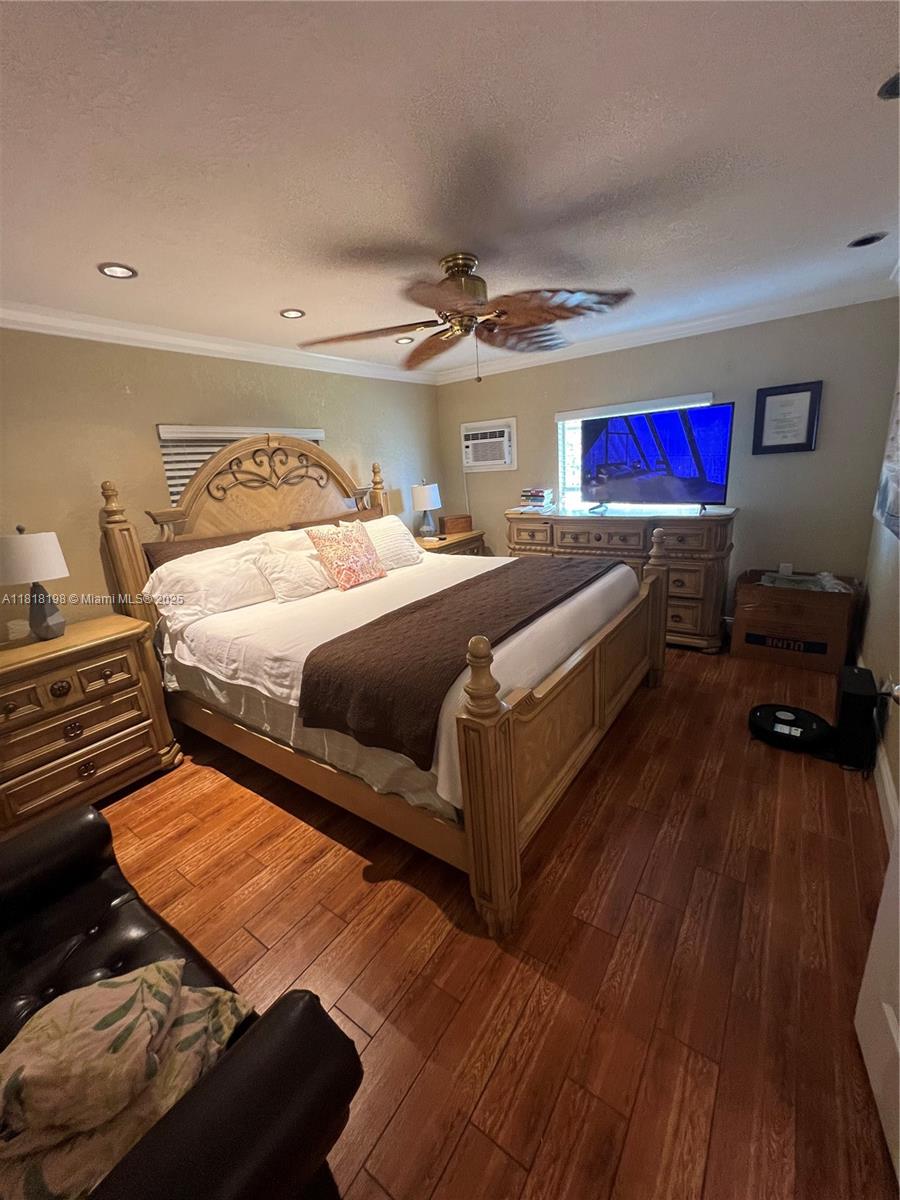 Davie Davie, FL 33324 - Photo 18 of 25 a bedroom with a bed and wooden floor