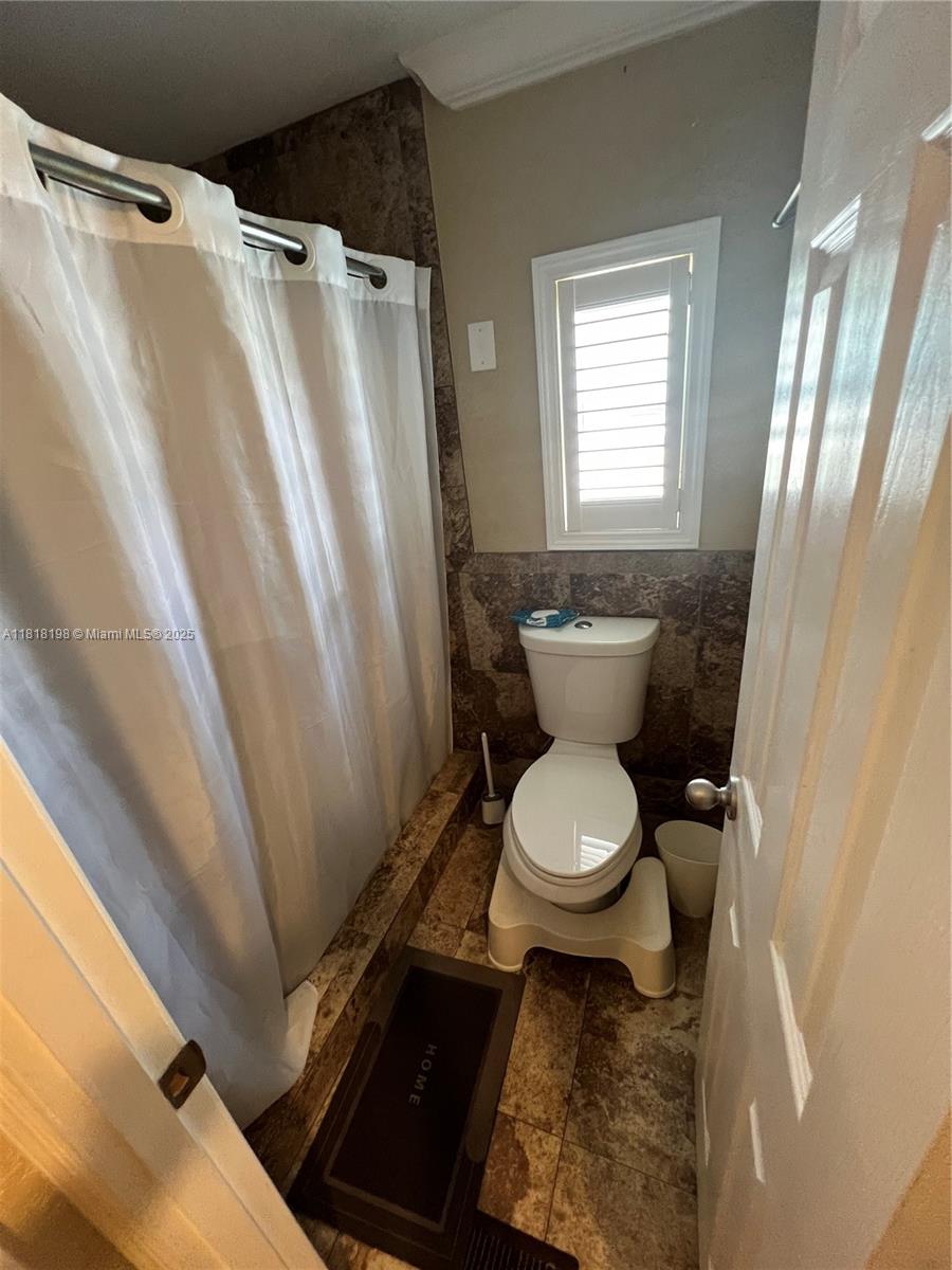 Davie Davie, FL 33324 - Photo 19 of 25 a bathroom with a toilet and a sink