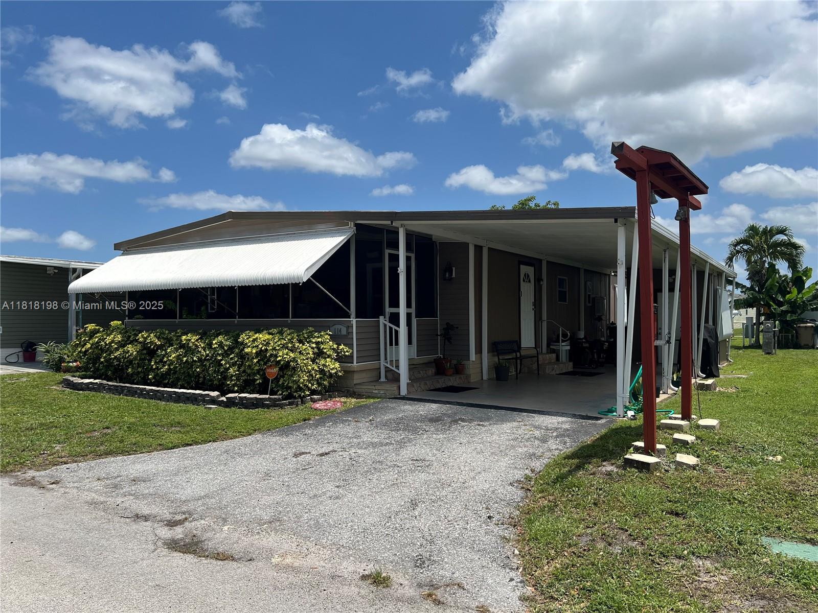 Davie Davie, FL 33324 - Photo 2 of 25 a front view of a house with a yard